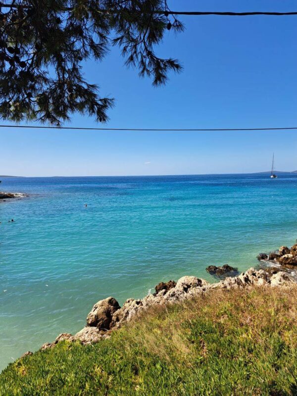 Turquoise Adriatic Sea beside the rocky coastline of Silba Island Croatia