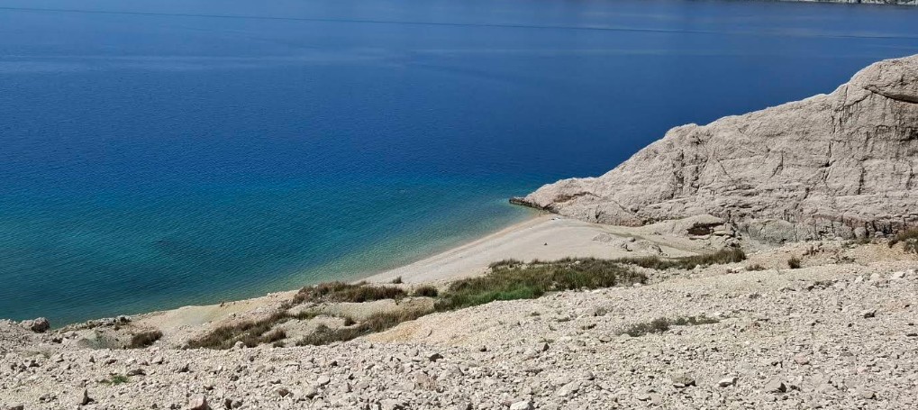Beritnica Beach on Pag Island with turquoise Adriatic water and dramatic limestone rock formations