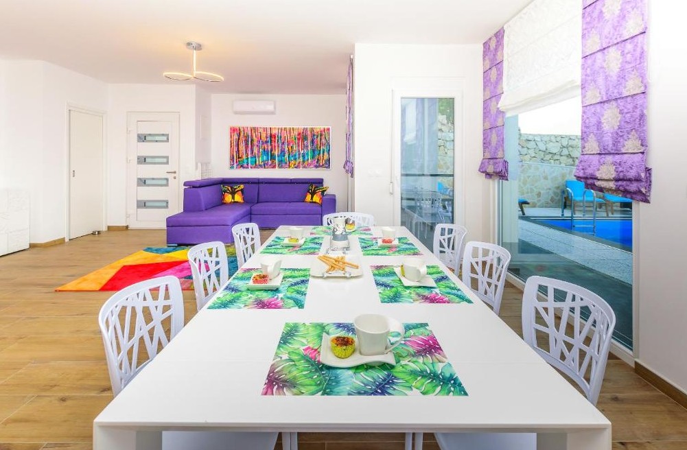 Modern holiday apartment interior with comfortable living area and equipped kitchen on Pag Island