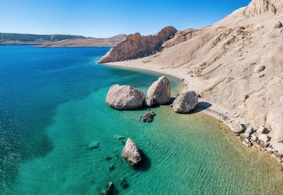 Turquoise Adriatic Sea and scenic rocky coastline with beautiful beaches on Pag Island, Croatia